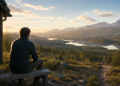 Man in quiet reflection outside a Scandinavian cabin, overlooking mountains at sunrise